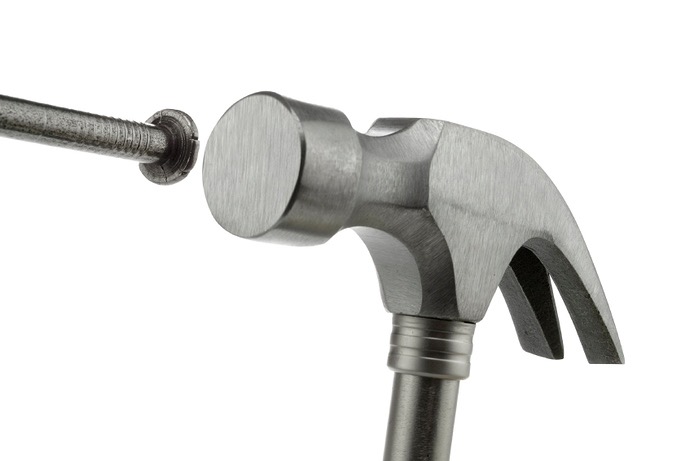 Hammer hits nail